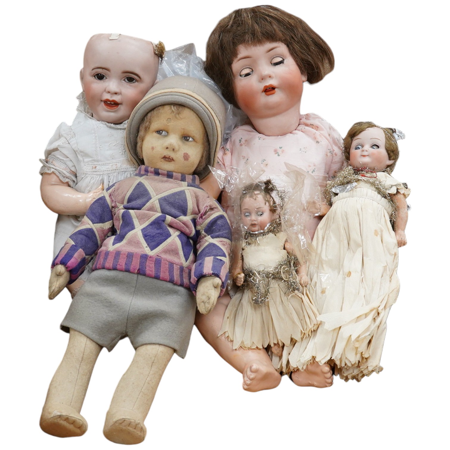 Six dolls, including a felt doll possibly by Nora L. Wellings (understood to have been purchased from Liberty's), a doll's house doll, an SPBJ Paris doll, a German Bruno Schmidt doll, etc. Condition - fair to good.